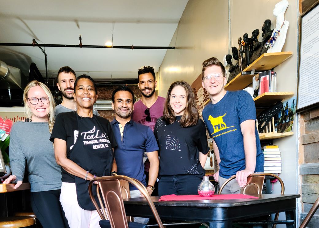 TUF volunteers with the owner of TeaLee's Teahouse and Bookstore in Denver