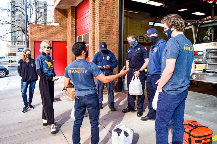 TUF volunteers in masks delivering meals to Denver firefighters in 2020